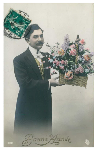 Handsome French Man with waxed mustache holding basket of roses and flowers