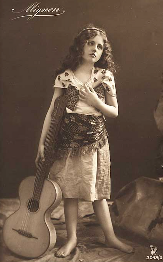Little Barefoot Gypsy with her guitar